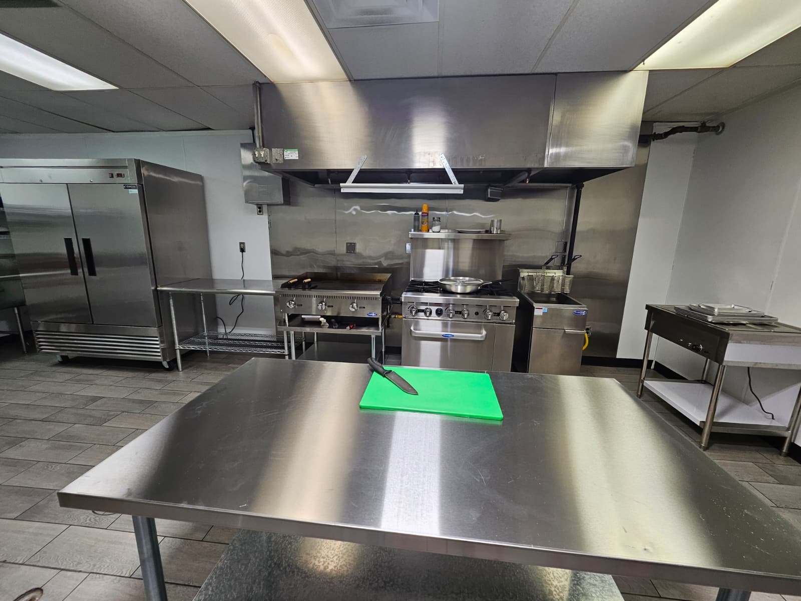 The Roaming Fork commercial prep kitchen with stainless-steel tables and professional cooking equipment